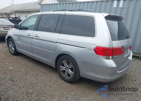 2010 Honda Odyssey Touring z USA, uszkodzony, nr VIN 5FNRL3H9XAB085936